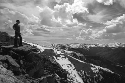 Picture of man looking out over mountain vista